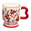 Isolated vintage aesthetic ceramic pedestal mug on a white background, featuring dark red floral oil painting patterns and a red wavy handle. Elegant script text is partially visible on the footed base.