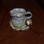 Artisanal pottery mug set with matching saucer and spoon in gift box