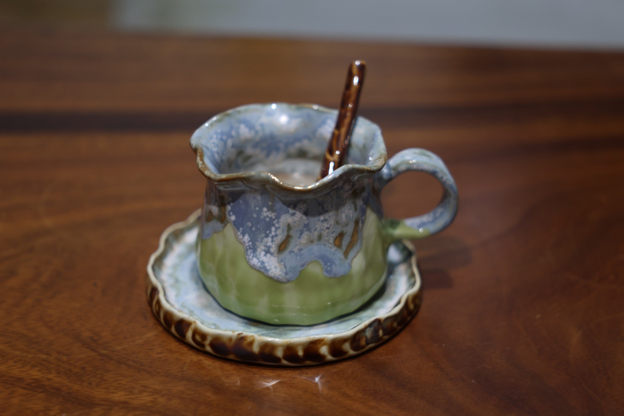 Artisanal pottery mug set with matching saucer and spoon in gift box