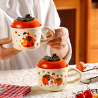 cute persimmon cat ceramic mug with lid on cozy coffee table