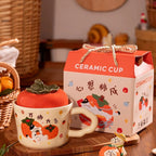 cute persimmon cat ceramic mug with lid on cozy coffee table