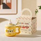 cute animal ceramic mug with lid on cozy desk setup
